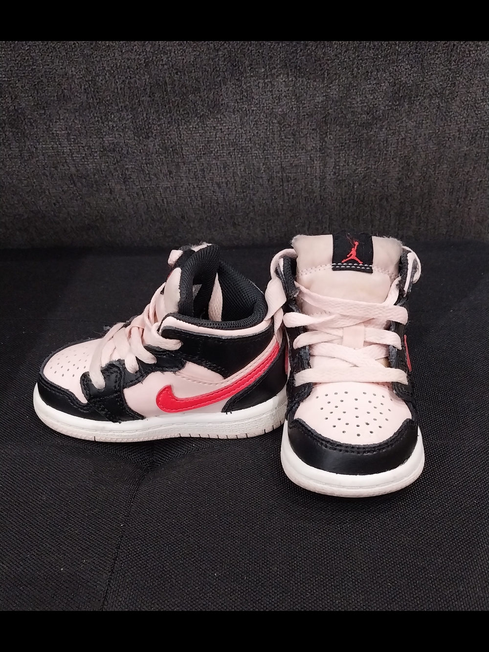 Nike Air Jordan 1 Pink and Mid Sneakers with Red Accent